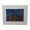 Reproduction of an art piece that features a navy background and green and orange abstract stars.