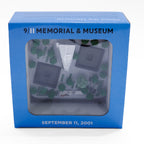 3D Memorial Plaza replica which includes the museum, memorial pools, survivor tree, tridents and memorial glade, in its packaging.
