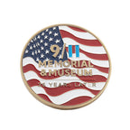 A round commemorative coin featuring the American flag with gold-toned text reading '9/11 Memorial & Museum' and '25 Years Later' on a plain white background.
