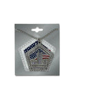 A silver-toned 9/11 memorial pendant necklace on a ball chain, displayed on a gray retail backing card. The pendant features a pentagonal design with the Twin Towers, stars, and red, white, and blue American flag details, plus the text 'NEVER FORGET' and 'SEPTEMBER 11, 2001'.
