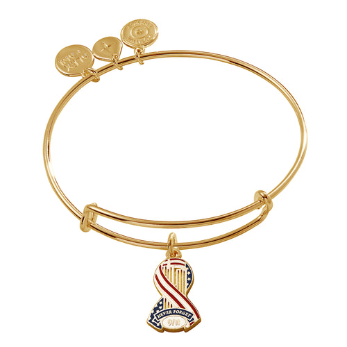 An expandable gold bangle bracelet with a charm featuring the 9/11 Memorial & Museum emblem.