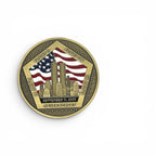 A commemorative round coin with a gold-toned border and a central design featuring the United States flag, the Twin Towers, and the text 'Flight 11', 'Flight 77', 'Flight 175', 'Flight 93', 'September 11, 2001', and 'Never Forget' on a white background.