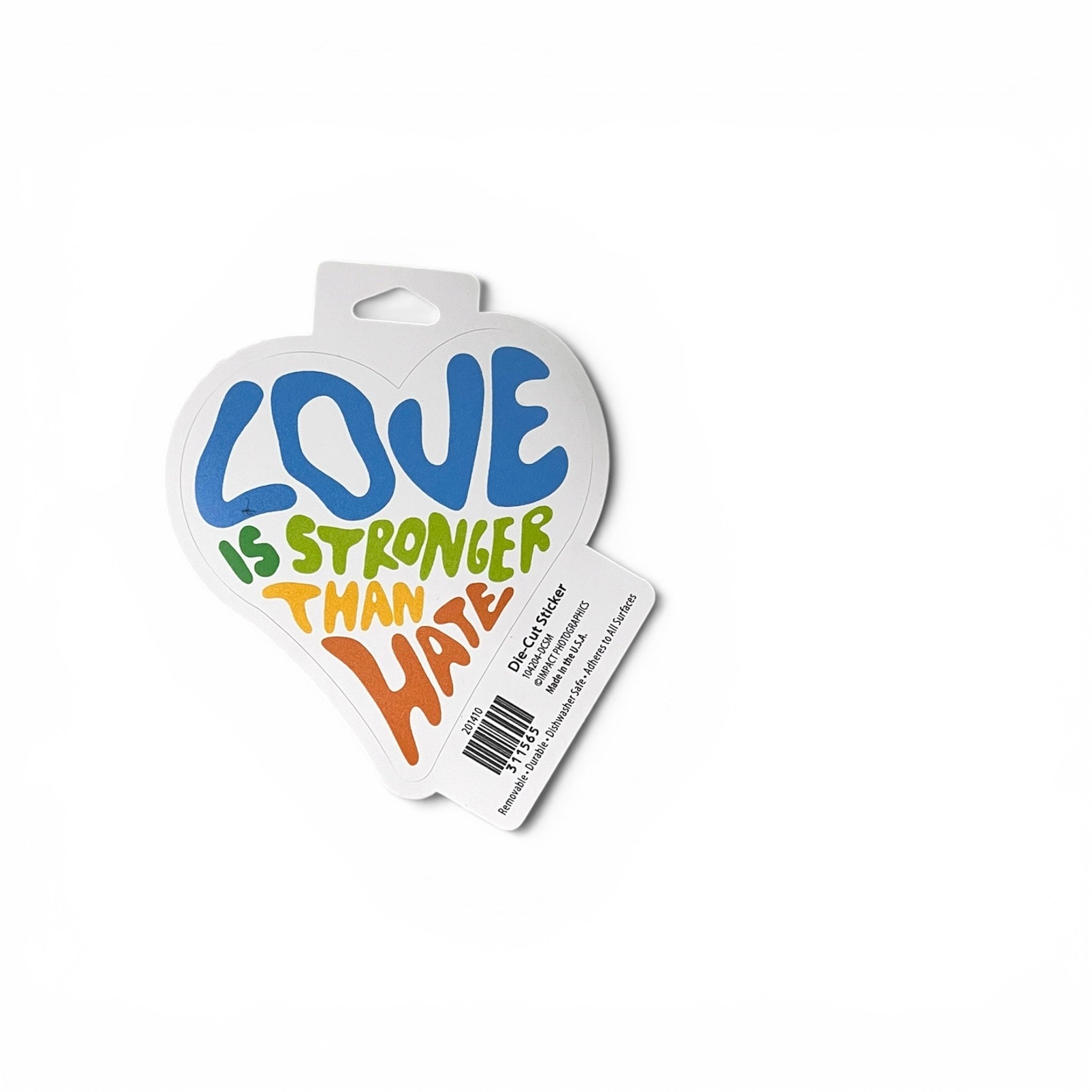 A heart-shaped car sticker with the text 'LOVE IS STRONGER THAN HATE' in colorful, playful lettering, shown on its retail hanger card against a white background.