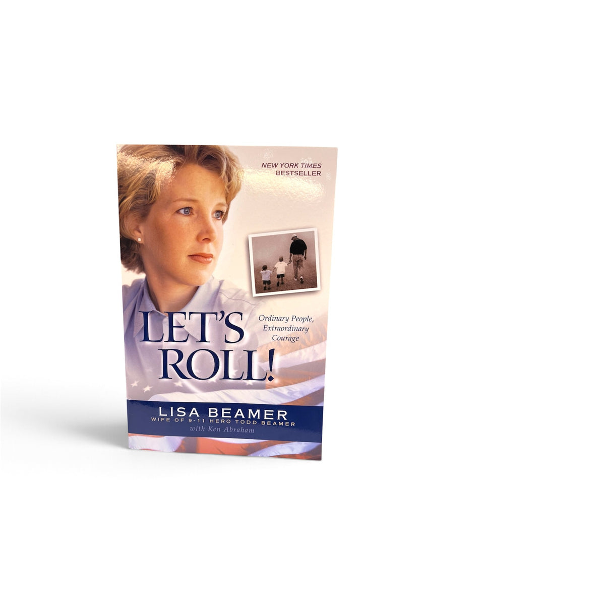 The book 'Let's Roll!' by Lisa Beamer, featuring a portrait of a woman with a blue title banner, shown on a plain white background.