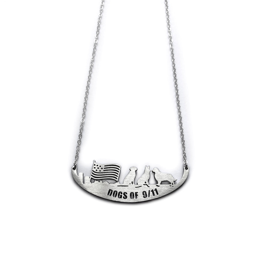 A stainless steel necklace with an engraved image of three dogs and a flag.