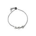 'I HEART NY' inscribed in sterling silver discs on a sterling silver adjustable rope bracelet.