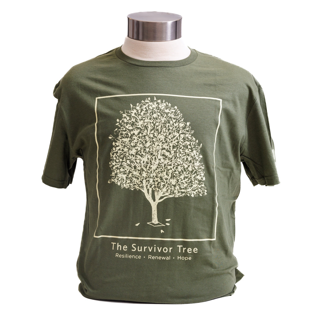 A green t-shirt displayed on a mannequin featuring a graphic of the Survivor Tree and the text 'The Survivor Tree"
