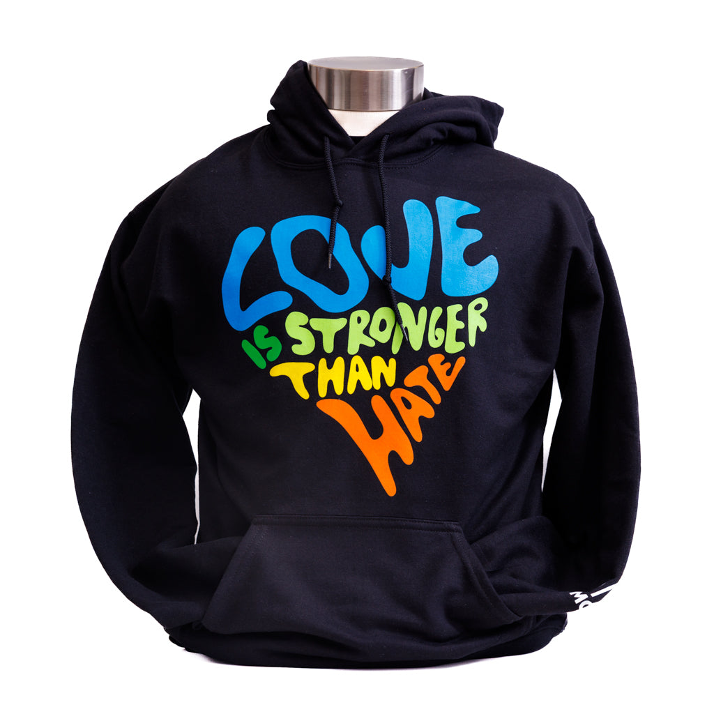 Black hoodie with colorful text 'LOVE IS STRONGER THAN HATE'.
