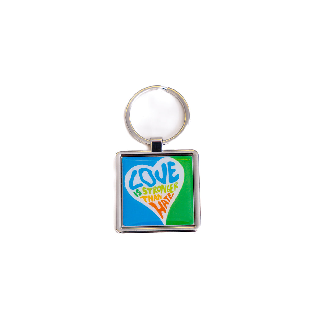 Keychain with 'Love is Stronger than Hate' design