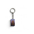 Twin Tower and Statue of Liberty image with a pink background on a silver tone keychain.