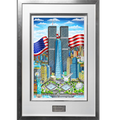 Framed art print of the New York City skyline featuring the Twin Towers, with American flags, a blue sky, and a silver frame with a white matte.