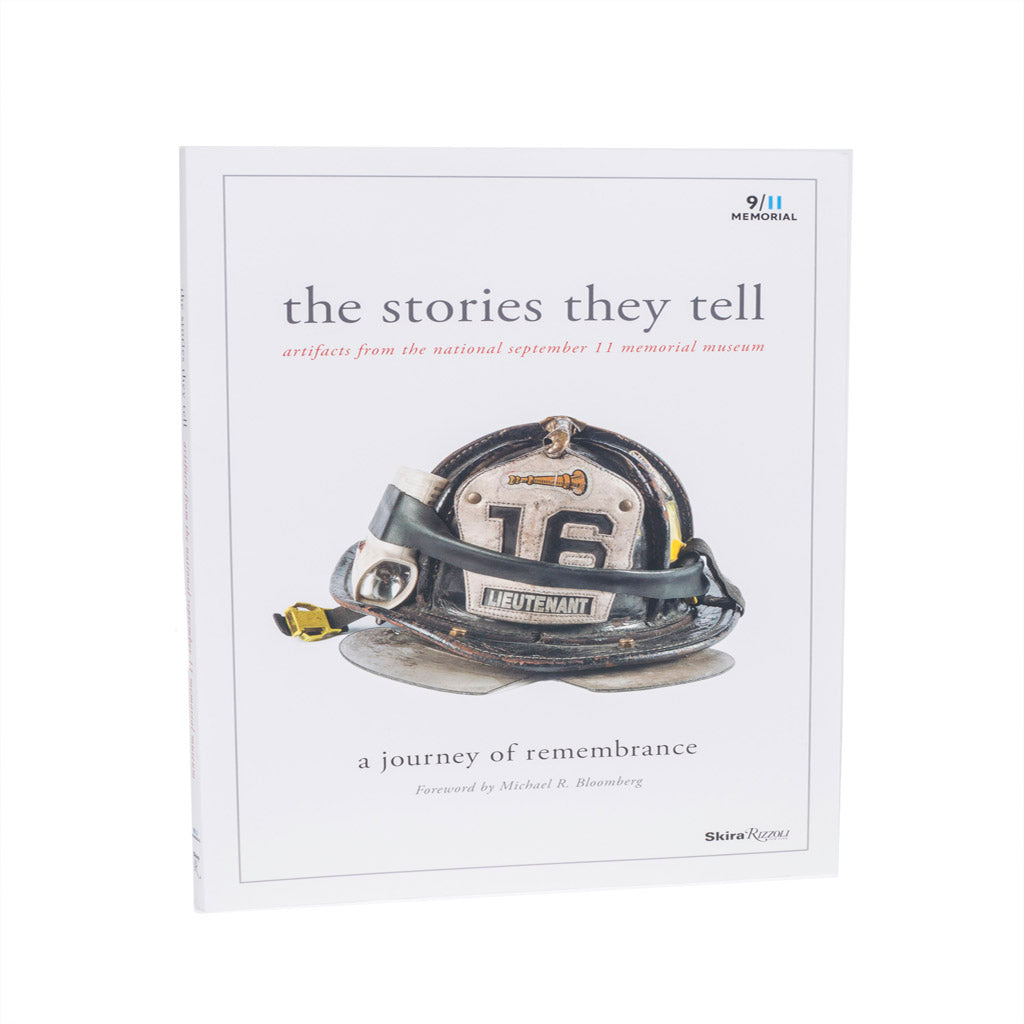 Book titled 'The Stories They Tell' with a fire helmet illustration on a white background