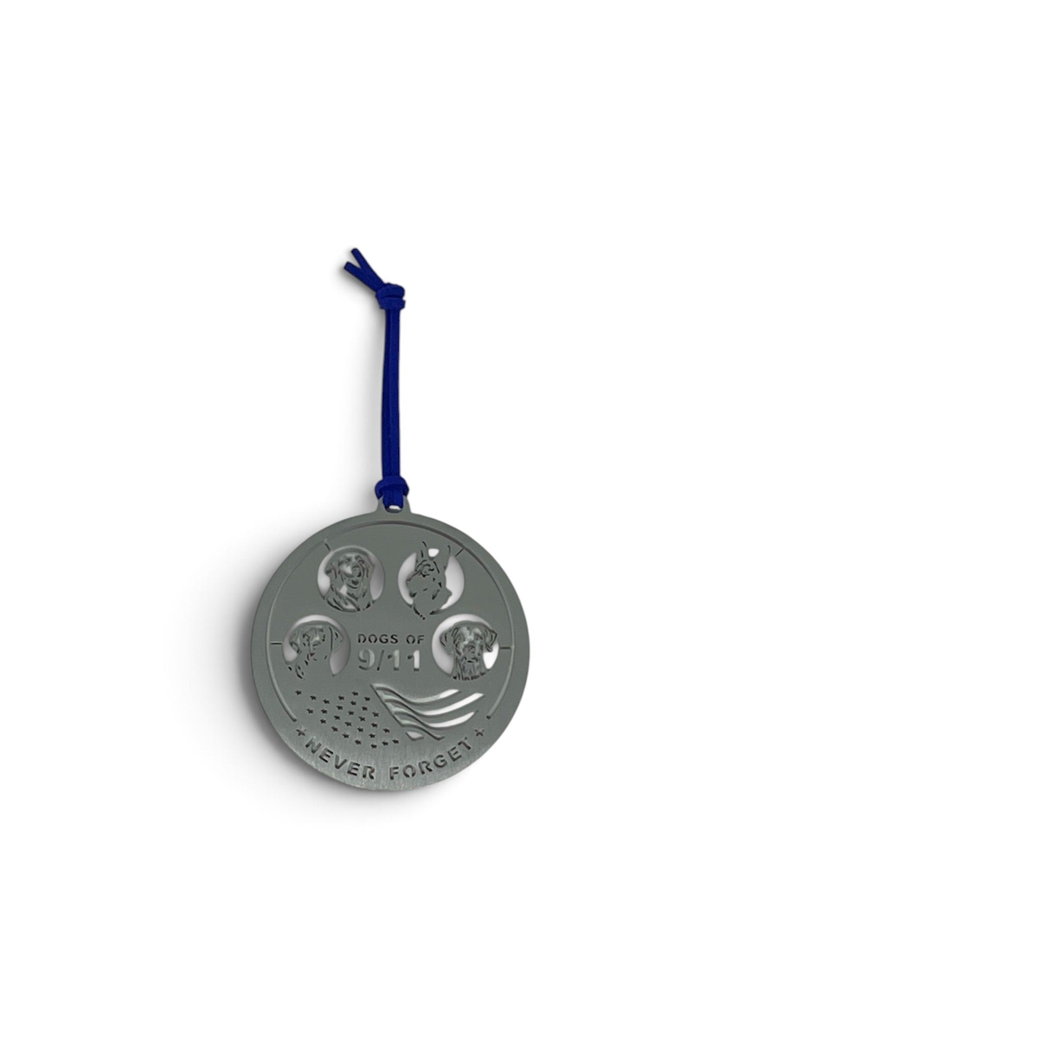 A round silver-toned metal memorial ornament with a blue hanging cord, featuring four rescue dog emblems and the words 'Dogs of 9/11' and 'NEVER FORGET'.