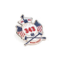 A lapel pin featuring the FDNY shield with the numbers 343, American flag, and the text 'NEVER FORGET'.