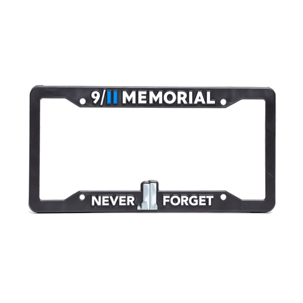 Black license plate frame with '9/11 Memorial' text on top and 'Never Forget' with a Twin Tower graphic on the bottom. 