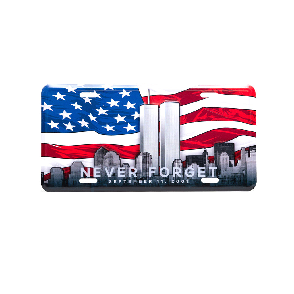 A patriotic license plate featuring the American flag and the silhouette of the Twin Towers with the text 'NEVER FORGET SEPTEMBER 11, 2001' across the bottom.