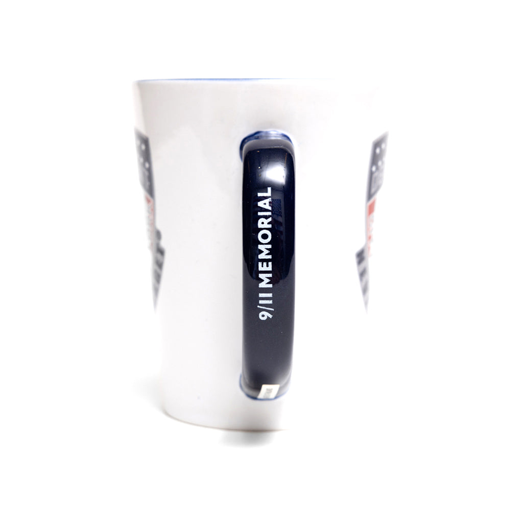 The navy mug handle showing the 9/11 MEMORIAL logo