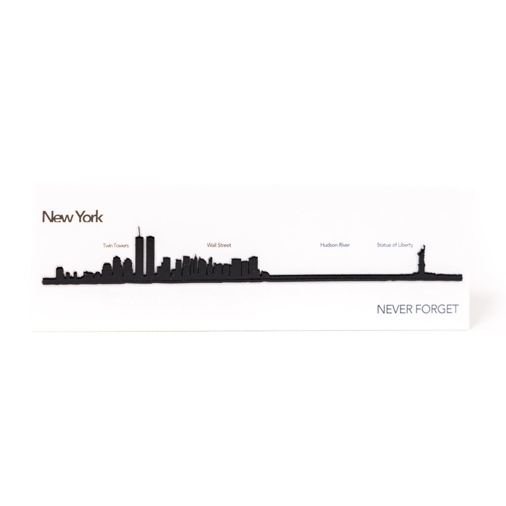 A laser-cut steel miniature skyline of New York, featuring the silhouette of the Twin Towers.