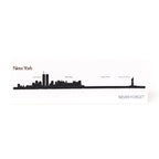 A laser-cut steel miniature skyline of New York, featuring the silhouette of the Twin Towers.