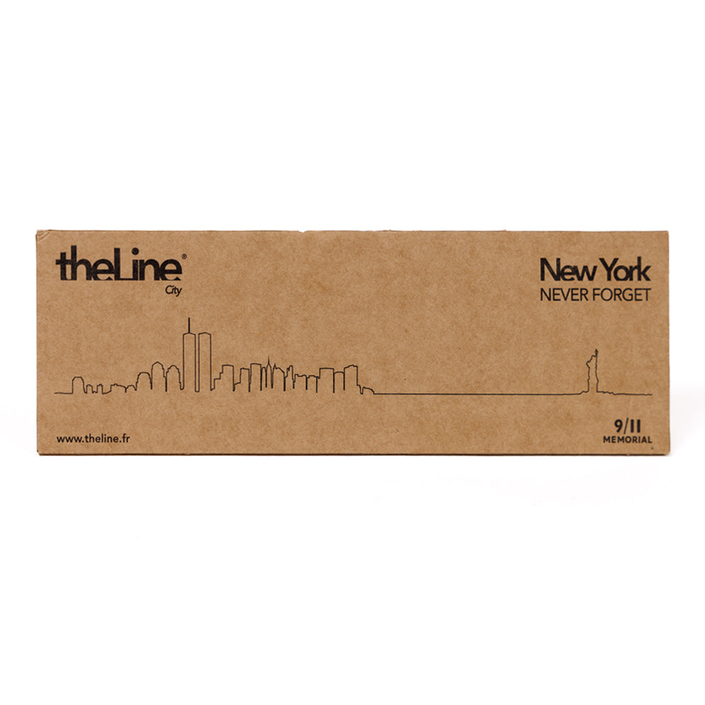 Cardboard box with a line drawing of New York City skyline and text on a white background