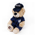 Teddy bear wearing a police uniform and hat on a white background