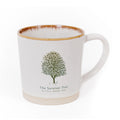 Mug with a tree design and 'The Survivor Tree' text on a white background