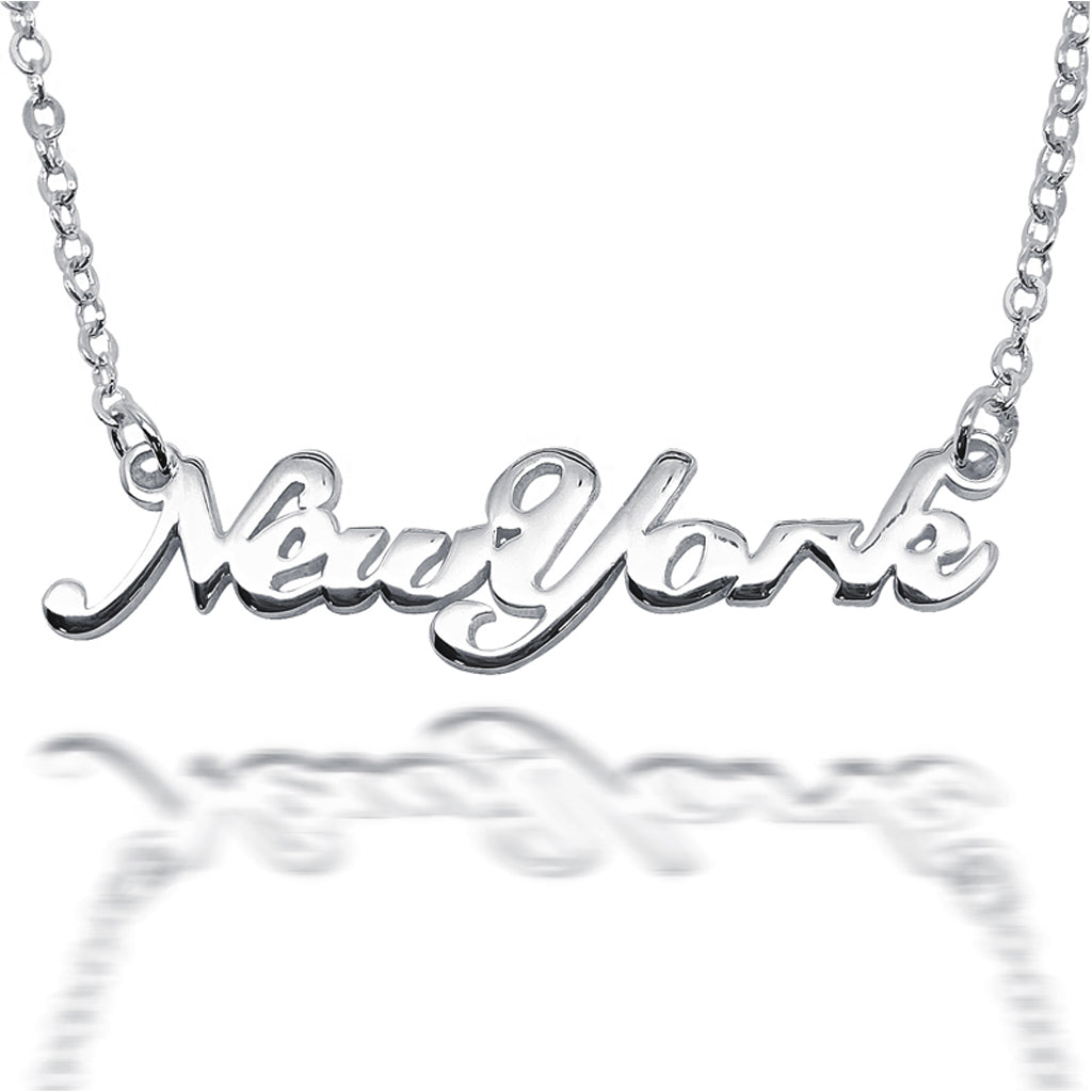 Close up of silver 'New York' necklace on a white background