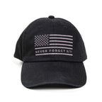 A black cap with an embroidered American flag and the text 'NEVER FORGET 9/11' on the front.