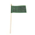 A green rectangular flag with the text 'NEVER FORGET 9/11' printed on it, attached to a wooden pole.