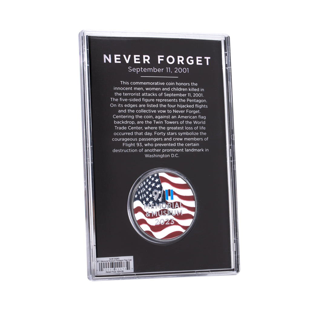 A commemorative coin with a US flag and Twin Towers design, housed in a clear display case, with 'NEVER FORGET' text on the case.