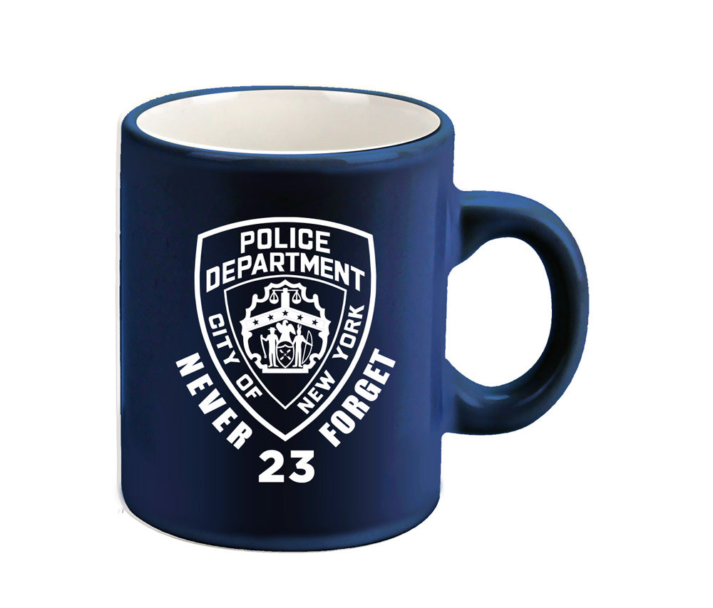A navy mini mug with the NYPD Department logo, Never Forget and the number 23.