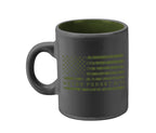 A glossy charcoal mini mug with green interior and a green American flag design and the text 'NEVER FORGET 9/11/2001' on it.