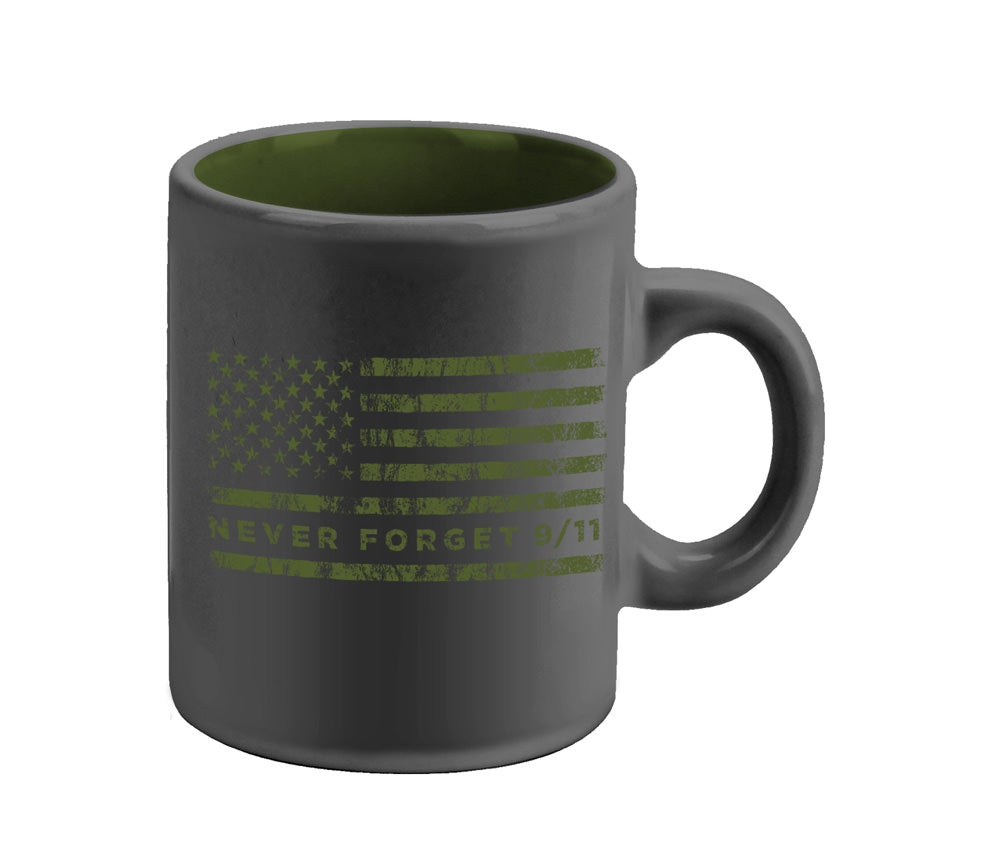 A glossy charcoal mini mug with green interior and a green American flag design and the text 'NEVER FORGET 9/11/2001' on it.