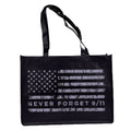 A black tote bag with a grey American flag design and the text 'NEVER FORGET 9/11' on it.